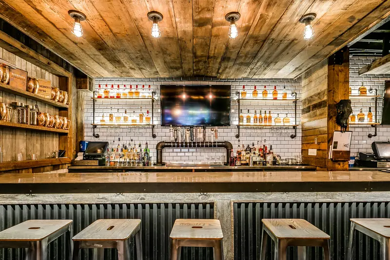 The long reclaimed-wood bar at Wayward in Federal Hill