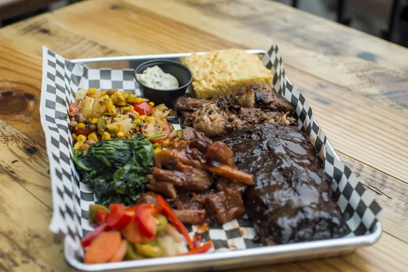 A Wayward smokehouse tray with smoked meats and sides